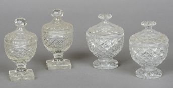 A pair of 19th century cut glass cups and covers together with another pair
Each with hobnail cut