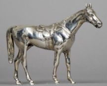 A silver model of a horse
Naturalistically modelled on all fours, the underside stamped 925.  13