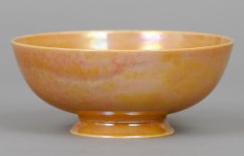 A Ruskin pottery bowl 
On spreading foot with orange lustre glaze, impressed mark Ruskin,