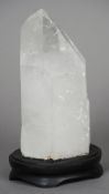 A rock crystal specimen
Mounted on an ebonised plinth base.  25 cm high. CONDITION REPORTS: Some