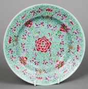 A late 19th/early 20th century Chinese famille verte dish
Decorated with floral sprays, the