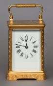 A late 19th century gilt brass cased striking carriage clock
The white enamel dial with Roman
