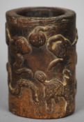 An antique Chinese carved "terracotta" brush pot, 16 Kingdoms Eastern Jin
The exterior worked with