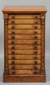 A 19th century yewwood and mahogany collectors' Wellington chest
With twin hinged columns and an