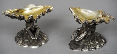 A pair of silver plate and gilt salts
Each formed as a lobster between two shells, the underside