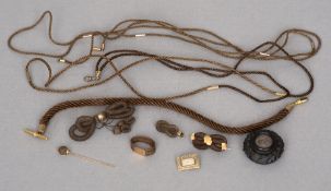 A collection of various unmarked yellow metal mounted Victorian braided hair jewellery
Including