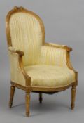 A 19th century French giltwood upholstered armchair
The padded back surmounted with a bow tied