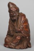 A Chinese carved bamboo figure of a sage
Modelled seated, holding a scroll.  16.5 cm high. CONDITION