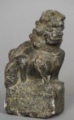 A Chinese carved stone Buddhistic lion, possibly Ming dynasty or earlier 
Typically worked.  15.5 cm