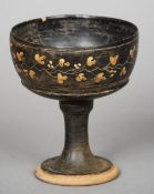 A Roman pedestal bowl
The exterior decorated in the round with a floral band.  17 cm high.