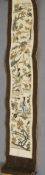 A Chinese embroidered sleeve panel
Worked with figures in a garden.  70 cm long overall.