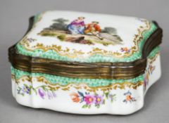 A 19th century Continental Sevres type porcelain box
The shaped hinged lid painted with a