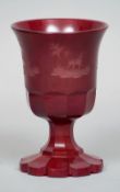 A Bohemian ruby glass goblet
Of typical form and decorated with etched hunting vignettes.  14.