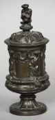 A 19th century patinated bronze vase and cover by Godfrey Sykes
The domed removable lid with a