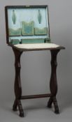 A late 19th century tooled leather covered lady's writing table
The hinged rectangular top enclosing