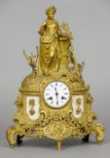 A 19th century French ormolu mantle clock
The floral and scroll cast case surmounted with a female