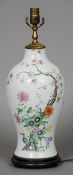 A Chinese porcelain table lamp Of ovoid vase form, decorated with a peach tree. 55 cm high.