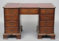 A late 19th century mahogany pedestal partners desk
The three piece leather inset inverted