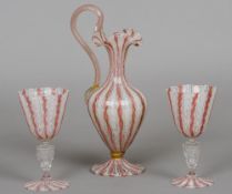 A pair of Venetian wine glasses together with an ewer en suite Each with a pink, gold and white