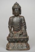 A Chinese Ming patinated bronze model of Buddha Typically modelled seated in the lotus position with