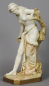 A large Royal Worcester figurine
Modelled as a semi-naked young lady leaning on a tree stump.  61 cm