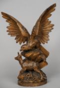 A 19th century Black Forest carving
Modelled as an eagle, perched above a young goat.  56 cm high.