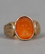 A 9 ct gold carved intaglio set seal ring
 CONDITION REPORTS: Overall good, some general wear.