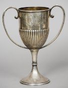 A Victorian silver trophy cup, hallmarked London 1899, maker's mark of JBLW
The stopped gadrooned