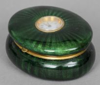 A Continental enamel watch set box Of oval form, the hinged lid inset with a watch with white dial