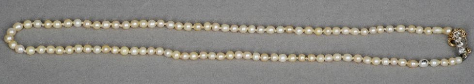 A single strand natural pearl necklace
The clasp set with four diamonds; together with a Gem & Pearl