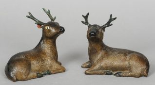 A pair of 18th century Chinese porcelain models of deer
Each naturalistically modelled in recumbent