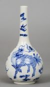 A 19th century Chinese blue and white bottle vase
The bulbous body decorated with a mythical beast