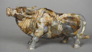 A large Chinese carved russet jade model of a bull
Naturalistically modelled.  22.5 cm long.