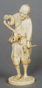 A late 19th century Japanese ivory okimono
Formed as a farmer, the underside signed.  18 cm high.