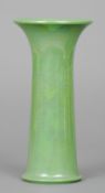 A Ruskin pottery vase
With flared rim and green lustre glaze, impressed mark Ruskin, England and