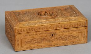 A 19th century Chinese carved wooden box
With all over floral and geometric carvings, the hinged