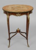 A 19th century ormolu mounted marquetry inlaid centre table
The florally inlaid oval top above the