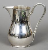 A Continental 800 standard silver jug
Of baluster form with loop handle, stamped 800 and with