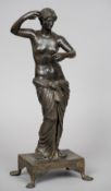 After the Antique, a Grand Tour patinated bronze figure
Formed as a semi-naked female, standing on a