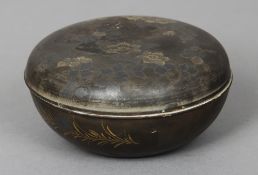 A 19th century Japanese porcelain box and cover
Of circular form, with faux bronzed patination.