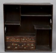 A late 19th/early 20th century Japanese hardwood cabinet
With a configuration of shelves and three