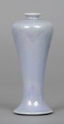 A Ruskin pottery vase
Of slender form with lilac lustre glaze, impressed mark Ruskin, England and