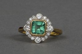 An Art Deco style 18 ct gold and platinum, diamond and emerald ring
The emerald approximately 6.5