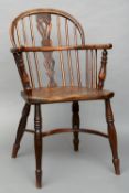 Two early 19th century yewwood and elm Windsor chairs
Each with a pierced central back splat above