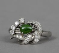 An Art Deco diamond and jade set platinum ring
 CONDITION REPORTS: Generally in good condition,