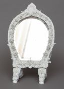 A 19th century Meissen banc de chine table mirror
With scrolling floral and shell motif decorations.