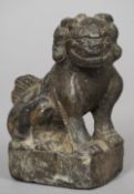 A Chinese carved stone Buddhistic lion, possibly Ming Dynasty or earlier
Typically worked.  16 cm