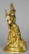 A late 19th/early 20th century gilt bronze and ivory figure
Formed as a damsel holding a lamp, the