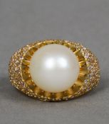 An 18 ct gold diamond and pearl set ring CONDITION REPORTS: Overall good, some general wear.