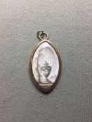 A George III memento mori 
Painted en grisaille on ivory with a classical urn initialled WP,